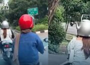 Kocak! Aksi Penumpang Motor Pakai Helm Teko Viral