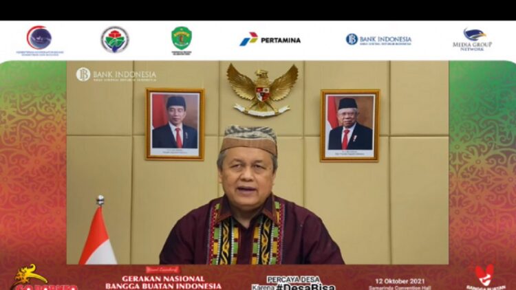 11,4 Juta UMKM Tersambung Platform Digital, Target Tercapai hingga 12 Juta Tahun Ini 1 Gubernur Bank Indonesia (BI) Perry Warjiyo berpartisipasi secara daring di Jakarta, dalam acara Peresmian Gerakan Nasional Bangga Buatan Indonesia (Gernas BBI), Selasa (12/10/2021). (ANTARA/Agatha Olivia)