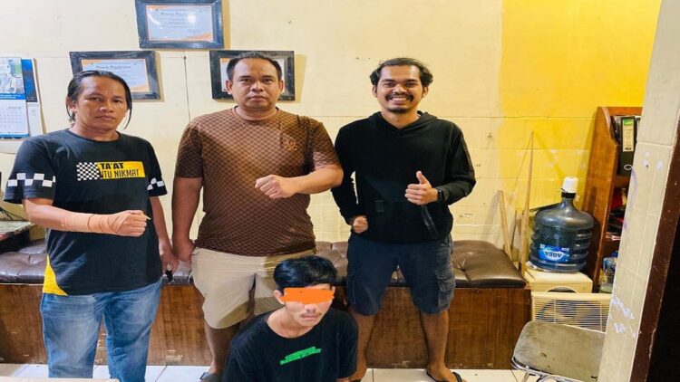 Pemuda ini ditangkap polisi karena mencuri HP dan uang yang ditinggal pemiliknya di dalam mobil yang diparkir. (IST)