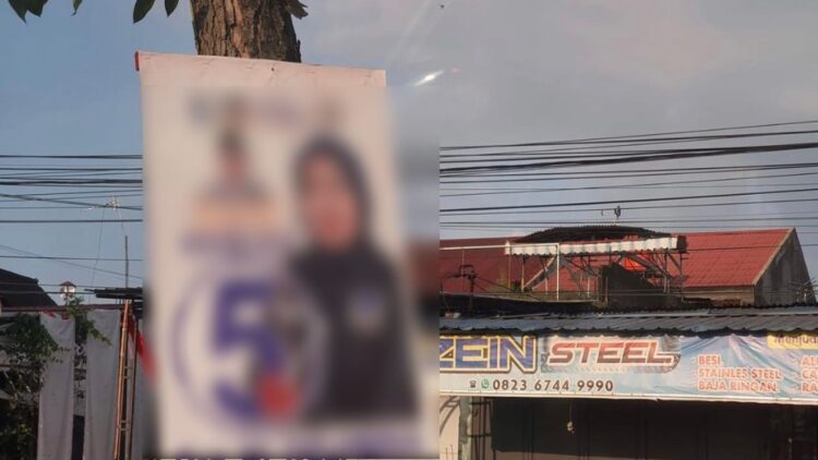 Salah satu poster caleg yang dipasang di pohon dengan cara dipaku. (Foto: Dok. Facebook.com/Indang Dewata)