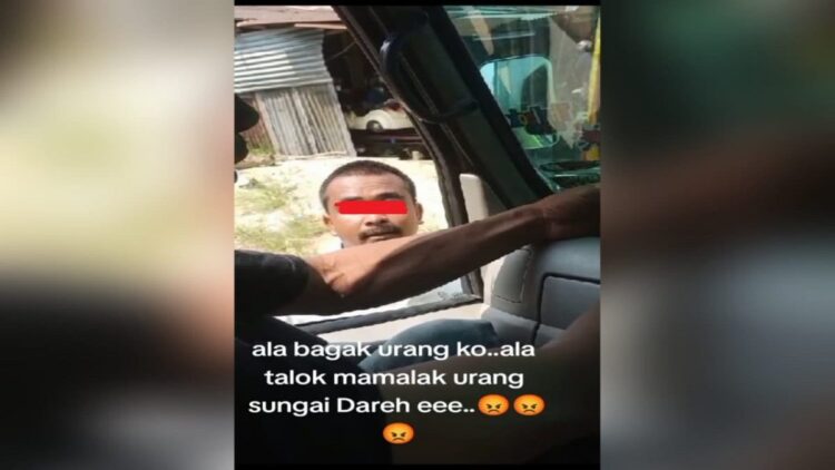 Ngaku Pribumi, Pemuda di Dharmasraya Diduga Palak Sopir Truk 1 Tangkapan layar pria pemalak sopir truk di Dharmasraya. (Foto: Dok. Istimewa/TikTok: @radputra87)