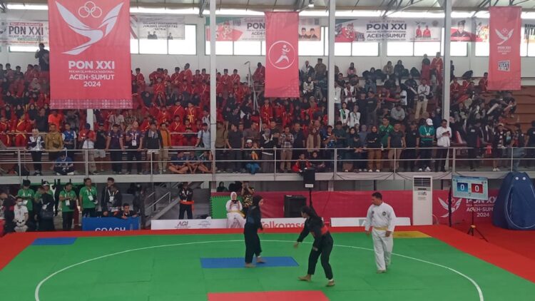 Gagal Lanjutkan Tradisi Emas, Pencak Silat Sumbang Perak di PON XXI 1 Laga final pencak silat putri PON XXI. (dok. istimewa)