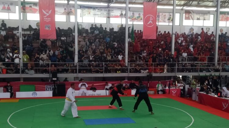 Pesilat Sumbar Sumbang Satu Medali Perunggu di PON XXI 1 Pesilat Sumbar Bintang hanya mampu raih medali perunggu setelah dikalahkan pesilat Papua di babak semifinal. (dok. istimewa)