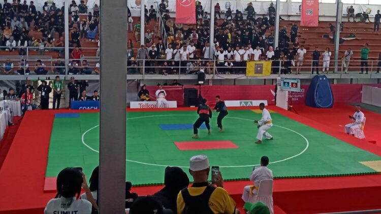 Pesilat Sumbar Lolos ke Semifinal PON XXI Usai Tundukkan DKI Jakarta 1 Pesilat Sumbar di PON XXI Aceh-Sumut lolos semifinal. (dok. istimewa)