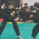 Atlet Pencak Silat dari Sumbar sedang bertanding di hari pertama laga cabor Pencak Silat PON Beladiri 2025. (dok. istimewa)